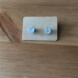 Faux diamond stud earrings with silver metal